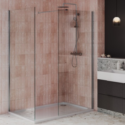 product lifestyle image of 1600mm x 900mm sided chrome walk in shower enclosure with 45mm high shower tray and waste in beige vertical tiled bathroom